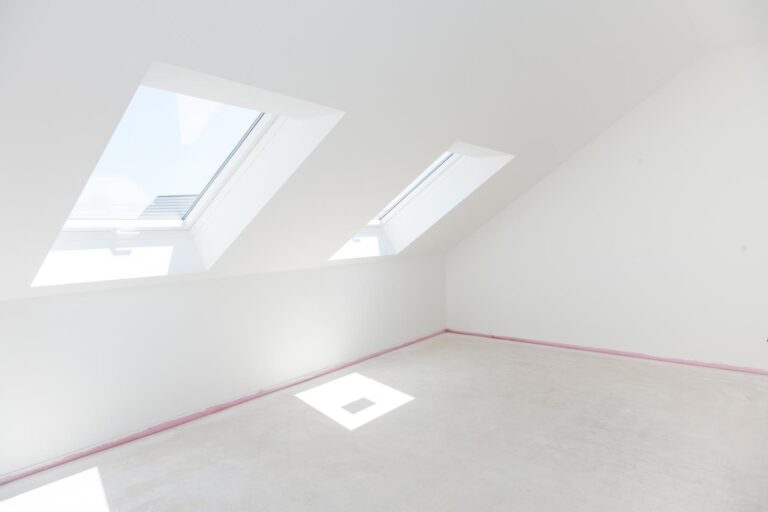 Loft refurbishment - empty room with skylight ready for renovation and new floor